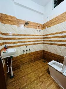 a bathroom with a sink and a bath tub at HOTEL SIYARAM Inn in Jāmb