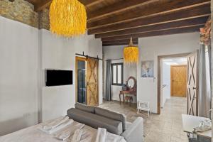 a living room with a couch and a table at The Iskemleci Guest House in Lefkosa Turk