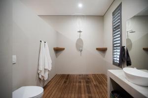 a bathroom with a toilet and a sink at Star Dam Lodges in Dargle +212 photos