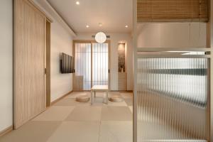 a hallway with a glass door and a table at HOYU INN's in T'ien-liao +40 photos