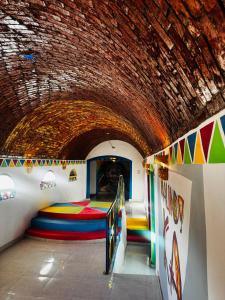 a room with a bed in a tunnel at malindy KA nubian houseماليندى كا in Aswan