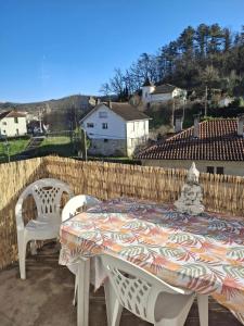 a table and two chairs sitting on a patio at Gîte l'Ermitage in Cahors