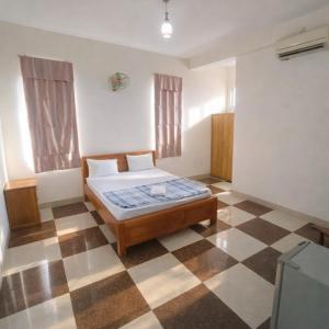 Giường trong phòng chung tại Hoàng Nam Hotel Thủ Đức +14 ảnh