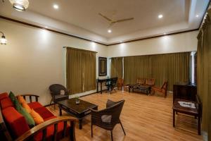 a living room with a couch and a table at The Hive Wayanad in Wayanad