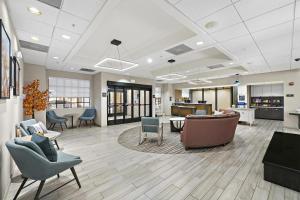 a lobby of a hospital with chairs and tables at Homewood Suites Lancaster in Lancaster +126 photos