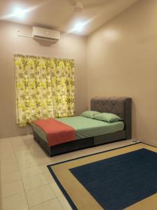 En eller flere senge i et værelse på damai homestay - feel like a home