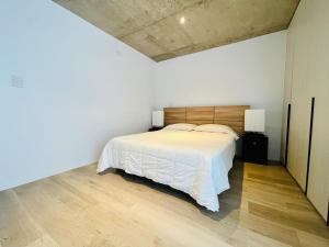 En eller flere senge i et værelse på Apartment with ocean views