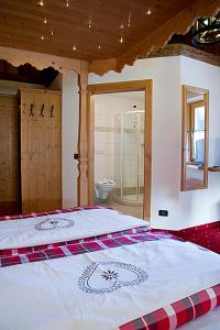 Postel nebo postele na pokoji v ubytování Hotel Garni San Nicolò