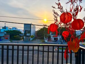 a view of a city street with red lanterns at HAPPY TEA Motel in Long Hai +13 photos