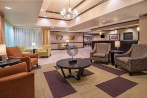 a lobby of a hospital with chairs and a waiting room at Wyndham Garden OKC Airport - Event Center, Indoor pool, Arcade Near Paycom, Fairgrounds in Oklahoma City