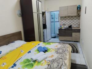 a bedroom with a bed with towels on it at TREF 1 in Soko Banja