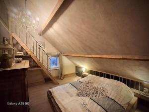 En eller flere senge i et værelse på La belle échappée & Romence