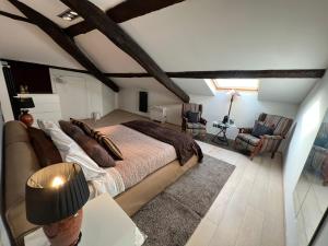 a bedroom with a bed and a living room at Charles in Verbania