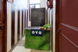 a sign that says oxy on a table in a hallway at Hotel O Govind Guest house in Jhājra +21 photos
