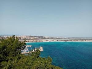 an aerial view of a beach and the ocean at Apartment in a farmhouse with 2 swimming pools in Cagli