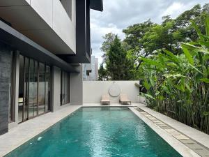 a swimming pool in the backyard of a house at Your Luxury Villa in the South of Jakarta in Samporo
