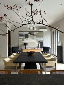 a dining room with a table and chairs at Your Luxury Villa in the South of Jakarta in Samporo