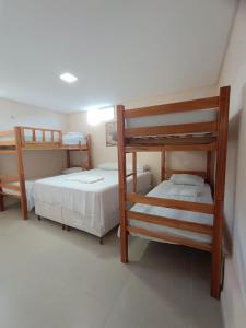 En eller flere senge i et værelse på Casa Beira Mar 4 quartos com Piscina Privativa Perto de Maragogi