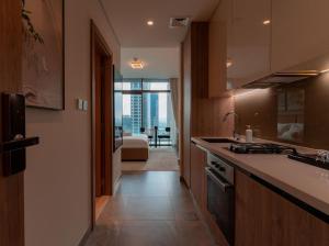 a kitchen with a view of a living room at Heaven's Dreams Business Bay in Dubai