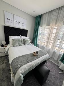 En eller flere senge i et værelse på MAITA Apartments