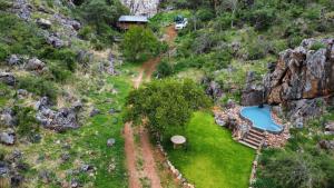 an aerial view of a house on a mountain at Glocke Mountain Camp, Cabin in Outjo