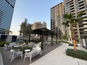 a gazebo with chairs and tables in a city at Heaven's Dreams Business Bay in Dubai