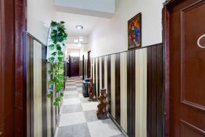 a hallway of a house with a tile floor at Hotel O Govind Guest house in Jhājra