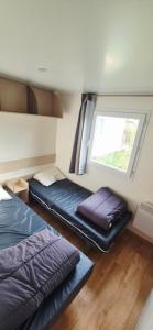 Giường trong phòng chung tại Mobilhome +24 ảnh