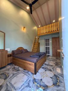 a bedroom with a bed and a staircase in a room at Magic holiday home in Matheran