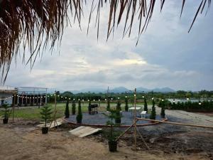 a garden with a bunch of trees and lights at LeLaNa Farmstay Camping in Pak Chong