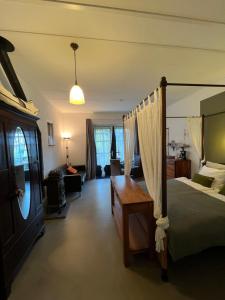 En eller flere senge i et værelse på Heerlijk Gaanderhei