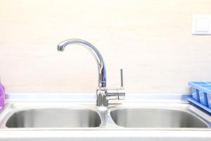 a kitchen sink with a faucet at EmilyApartments 1 in Chrysoupolis +45 photos
