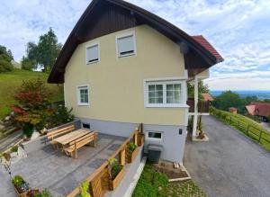 a house with a bench in front of it at Romy in Gundersdorf +17 photos