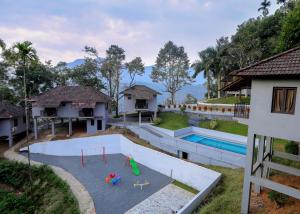 an aerial view of a house with a playground at Rippon Mount Resorts in Meppādi