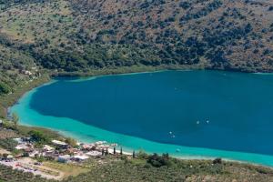 an aerial view of a lake on a mountain at Elinor Villa - Nature Retreat amidst Mountains & Lake by etouri in Chania