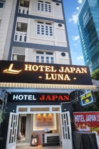 a hotel japan luana sign in front of a building at Japan Luna Hotel in Dĩ An