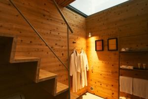 a room with a wooden wall with a staircase at A&A Okayama in Okayama +33 photos