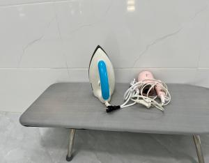 a table with a surfboard and shoes on it at Villa 1985 in Buon Ma Thuot +18 photos