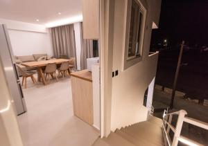 a kitchen and dining room with a table and chairs at Sinani Villas Rhodes in Afantou