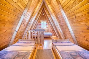 En eller flere senge i et værelse på "Domek na Wiejskiej 4" Polańczyk , 696-025-331