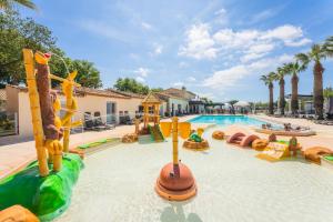 a pool at a resort with a water park at Holiday Marina Resort in Grimaud