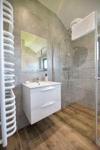 a bathroom with a white sink and a shower at Sun & Garden View in Oświęcim +49 photos