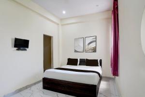 Et tv og/eller underholdning på Hotel O Krishna Villa