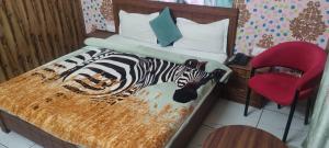 Giường trong phòng chung tại Hotel Neel Kamal