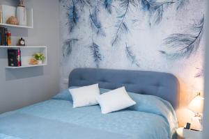 En eller flere senge i et værelse på Casa Yuliya 11