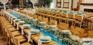 a long row of tables and chairs in a room at MOTOREST-PENSION U HRACHŮ,s.r.o. in Klatovy
