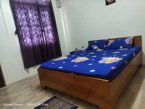 Giường trong phòng chung tại Adoreen Homestay