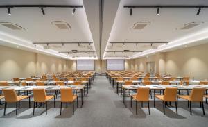 an empty room with tables and chairs in a classroom at Barceló Fortina Malta in Sliema +63 photos