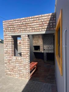 a brick oven in the side of a building at Eighth Avenue Self Catering Accommodation in Lüderitz