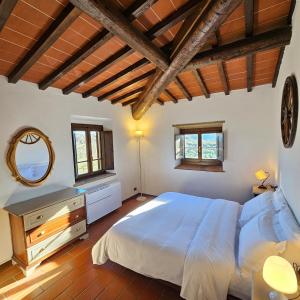 En eller flere senge i et værelse på Borgo La Casaccia